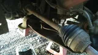 How to replace a driveshaft Front wheel drive cars [upl. by Nimoynib]